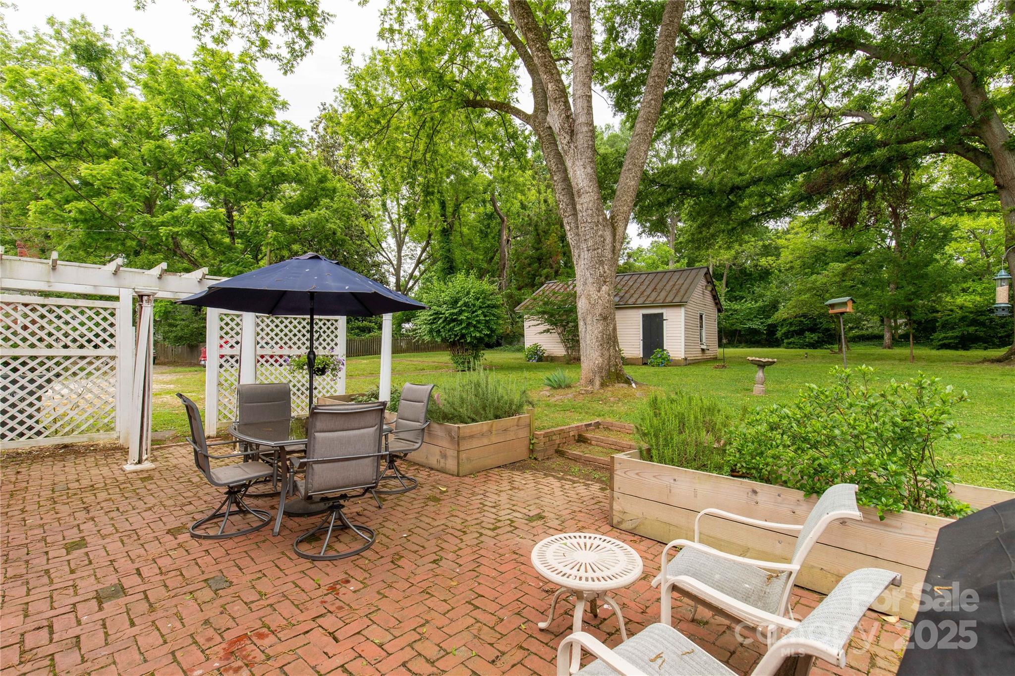 7 Kings Mountain Street York, SC 29745 - Photo 36 of 46 a view of a chair and table in backyard of the house
