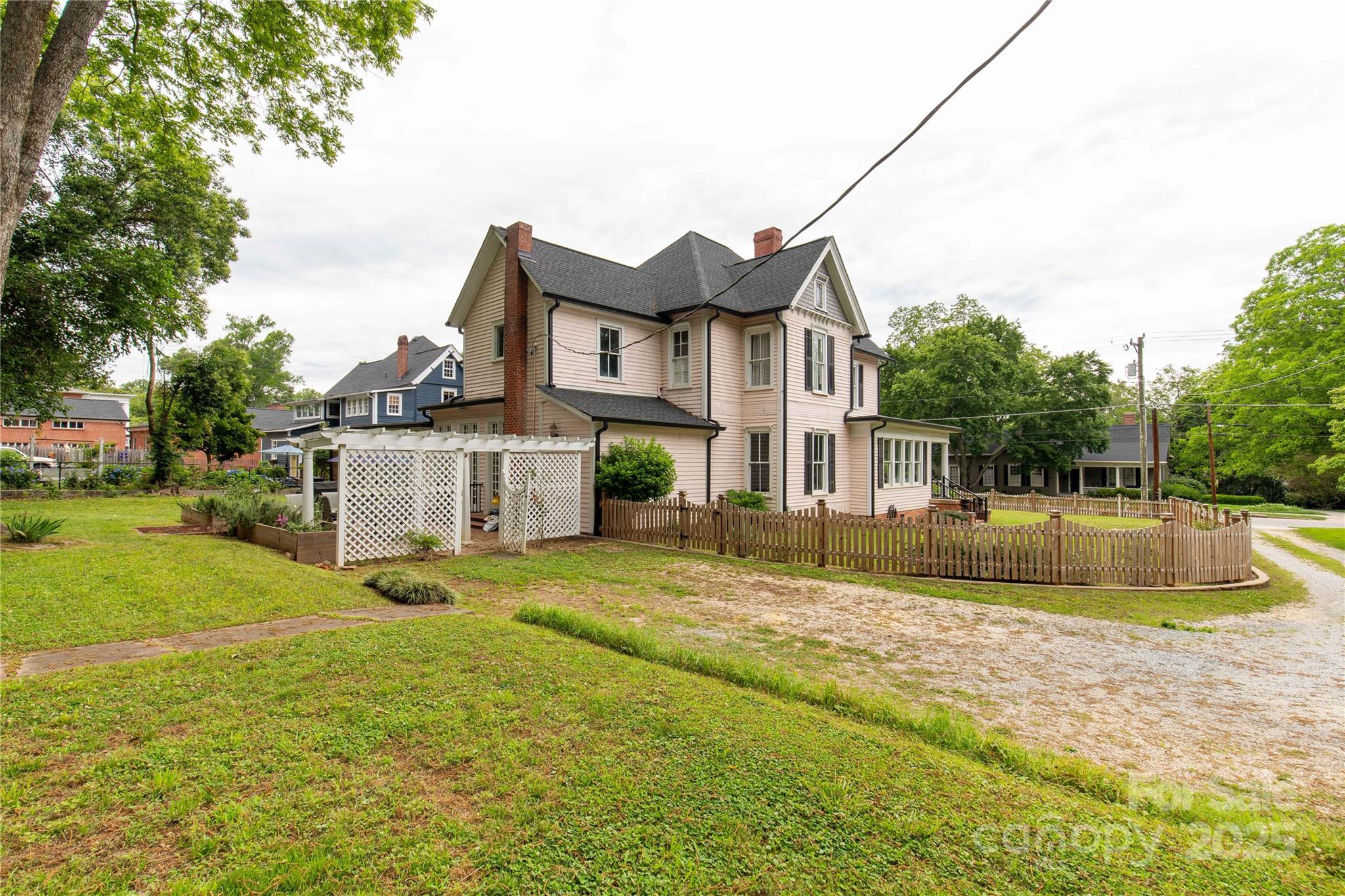 7 Kings Mountain Street York, SC 29745 - Photo 39 of 46 a view of a house with a big yard and large trees