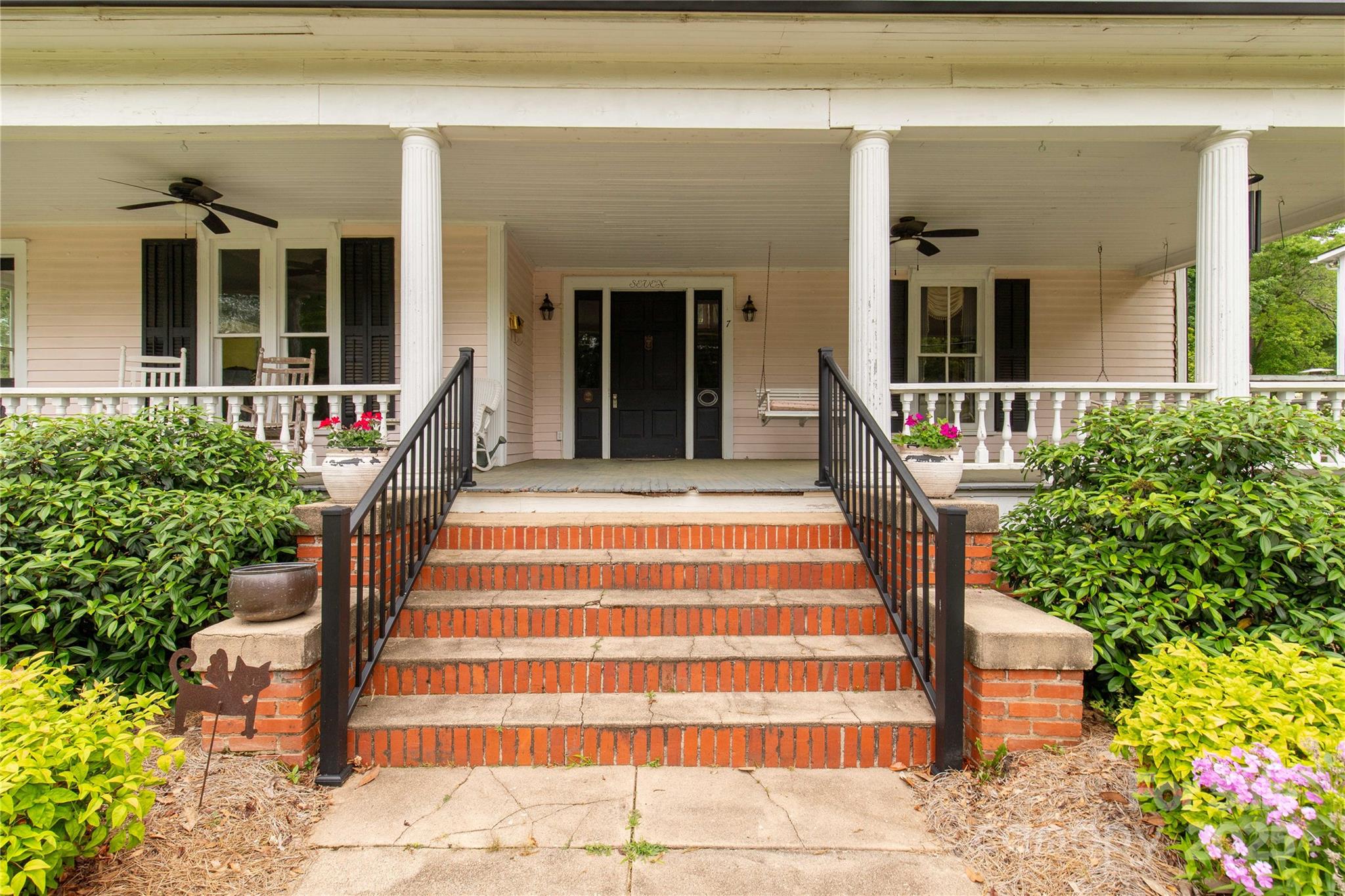 7 Kings Mountain Street York, SC 29745 - Photo 4 of 46 a front view of a house with a porch