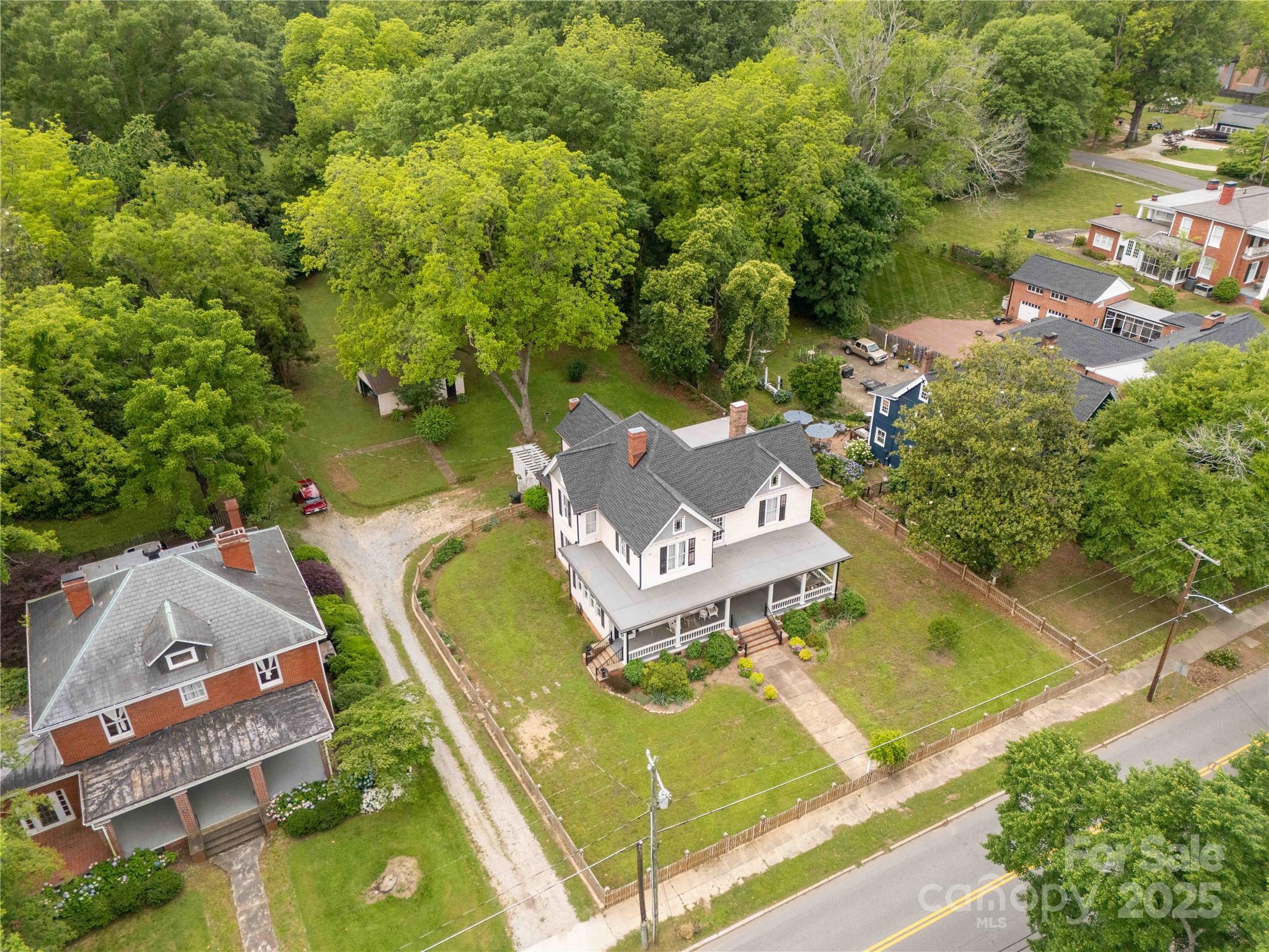 7 Kings Mountain Street York, SC 29745 - Photo 42 of 46 an aerial view of a house with swimming pool and lake view