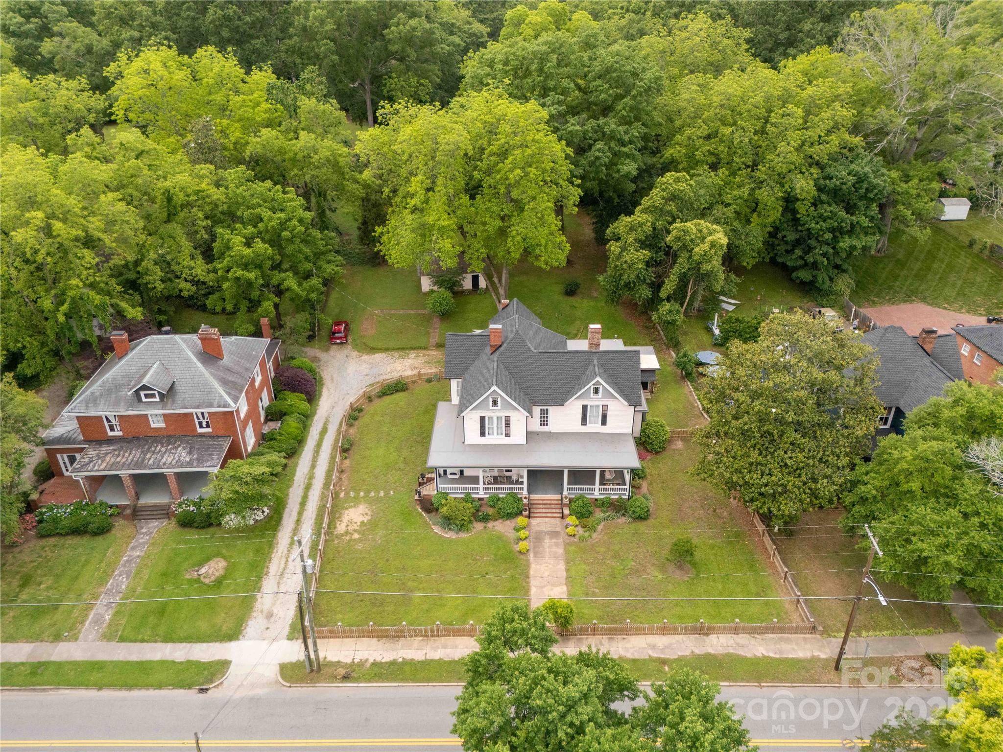 7 Kings Mountain Street York, SC 29745 - Photo 43 of 46 an aerial view of a house with swimming pool and garden
