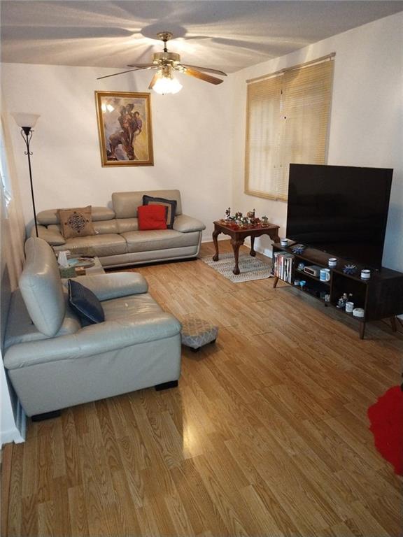 3398 Columbia Trace Decatur, GA 30032 - Photo 2 of 10 a living room with furniture and a flat screen tv