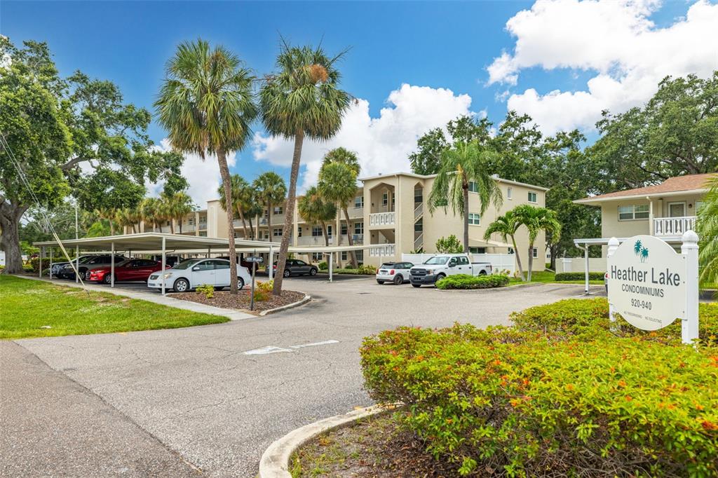 920 Virginia Street, Unit 207 Dunedin, FL 34698 - Photo 1 of 1 a view of a patio with swimming pool table and chairs