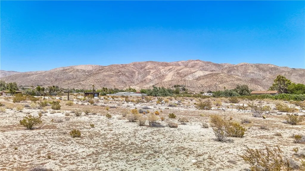 5 Dillon Road Desert Hot Springs, CA 92241 - Photo 15 of 25 a view of a field with mountains in the background