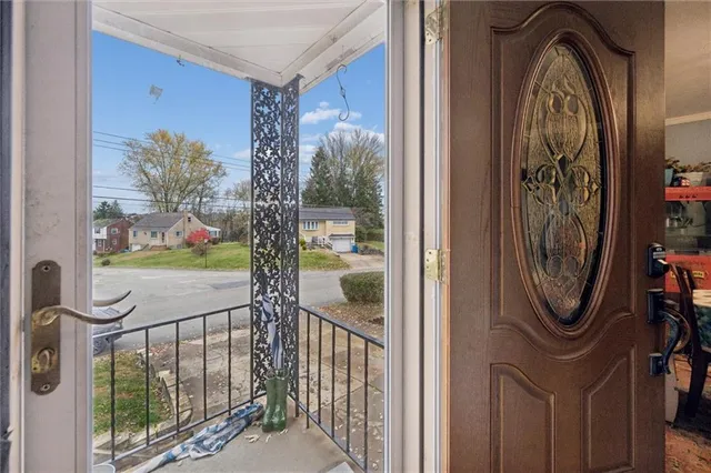a view of a entryway door with glass door