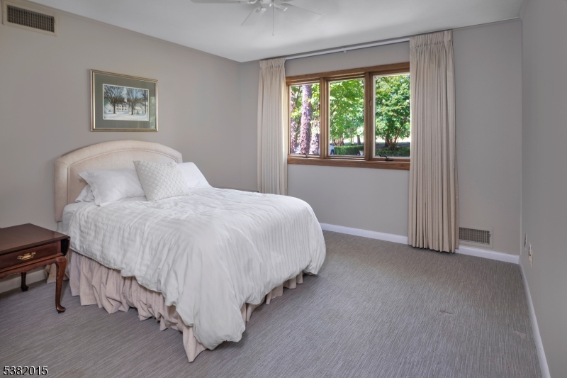 14 Hunter Road West Amwell, NJ 08530 - Photo 19 of 41 a bed sitting in a bedroom next to a window