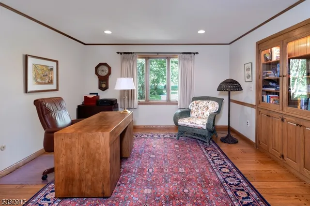 a living room with furniture rug and window