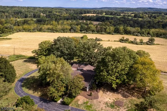 a view of a yard with wooden fence