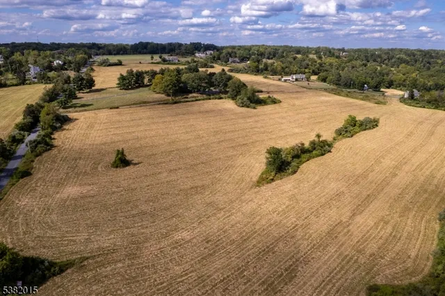 an aerial view of a houses with a yard