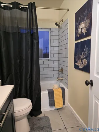 a bathroom with a toilet and shower