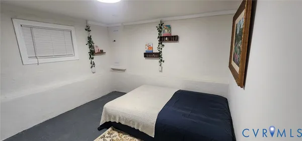 a bedroom with a bed and cabinets