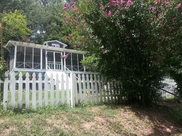 a view of front of house with a yard