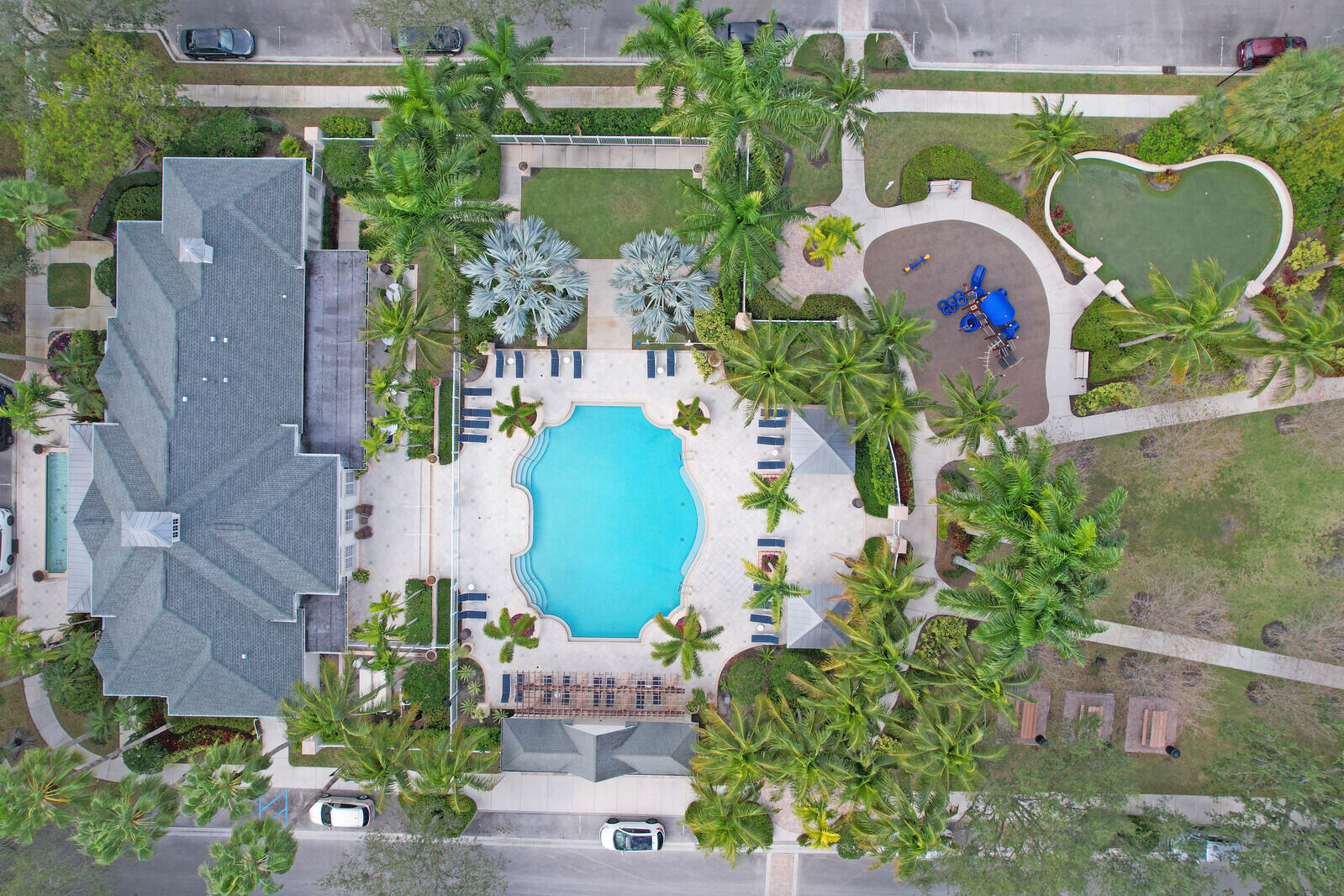 255 Murcia Drive, Unit 202 Jupiter, FL 33458 - Photo 52 of 56 an aerial view of a swimming pool outdoor seating