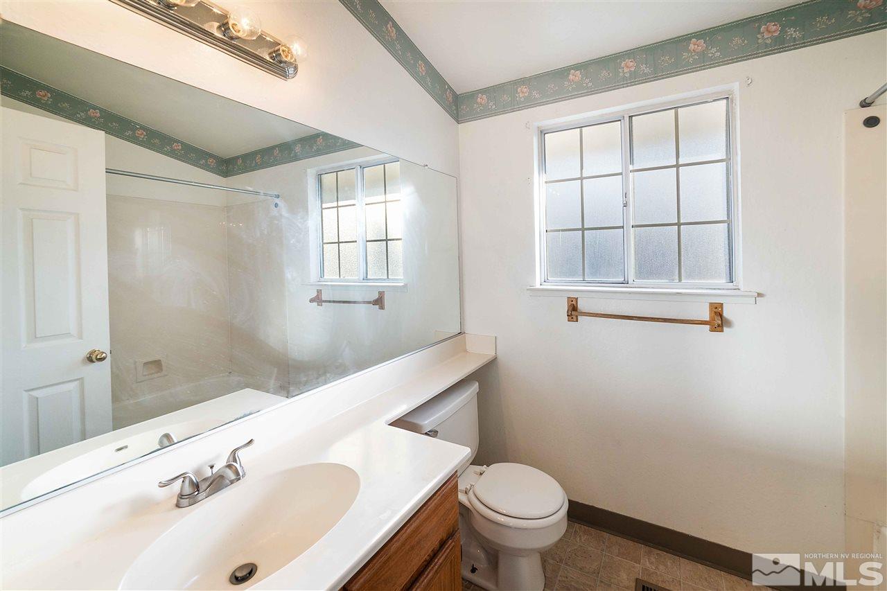 6314 Moon Ridge Terrace Reno, NV 89523 - Photo 17 of 24 a bathroom with a sink and a toilet