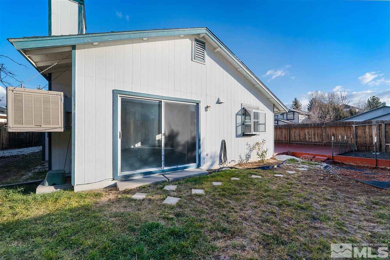 6314 Moon Ridge Terrace Reno, NV 89523 - Photo 23 of 24 a backyard of a house with seating space