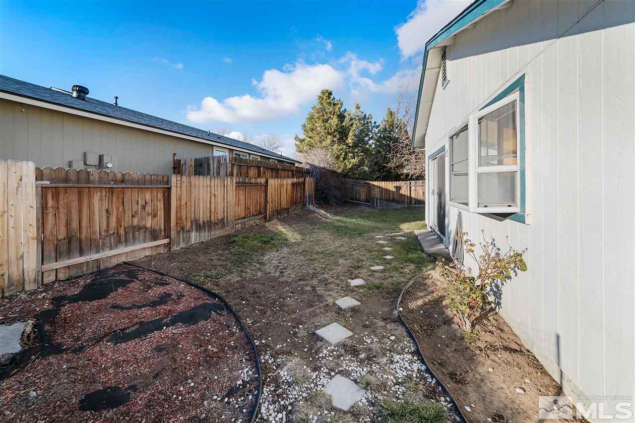 6314 Moon Ridge Terrace Reno, NV 89523 - Photo 24 of 24 a backyard of a house with lots of green space