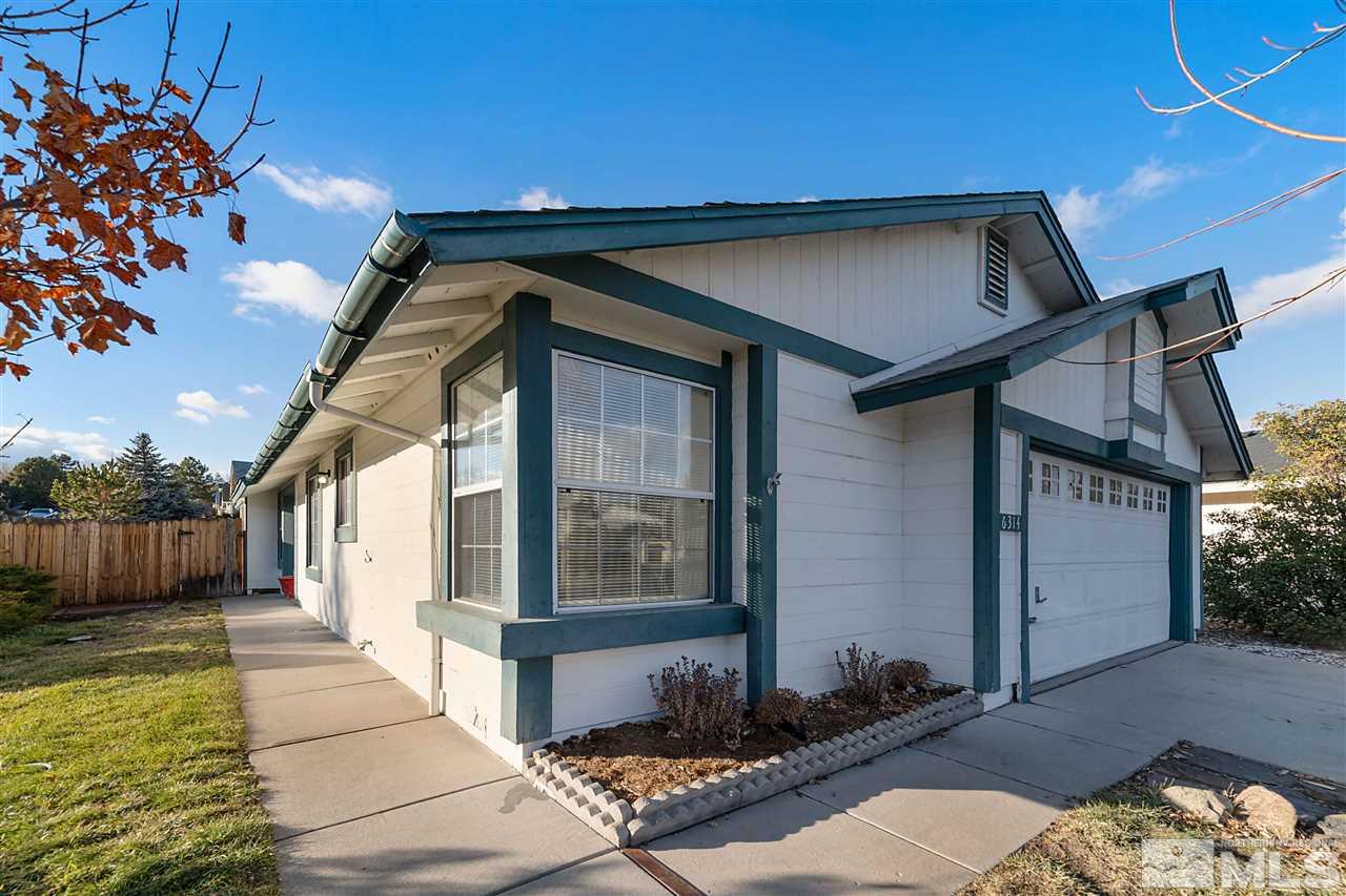 6314 Moon Ridge Terrace Reno, NV 89523 - Photo 3 of 24 a front view of a house with a yard