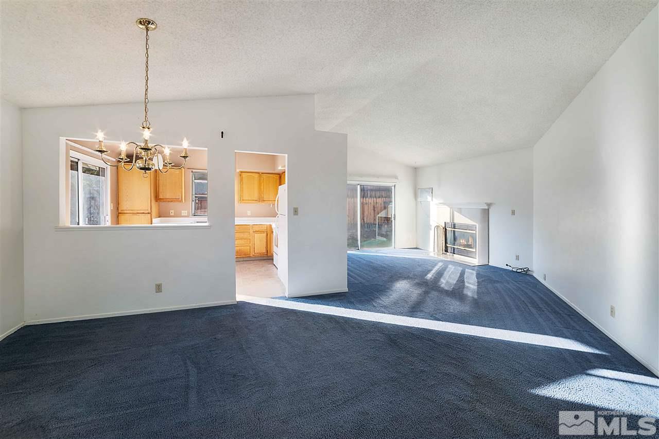 6314 Moon Ridge Terrace Reno, NV 89523 - Photo 5 of 24 a view of a room with window and chandelier