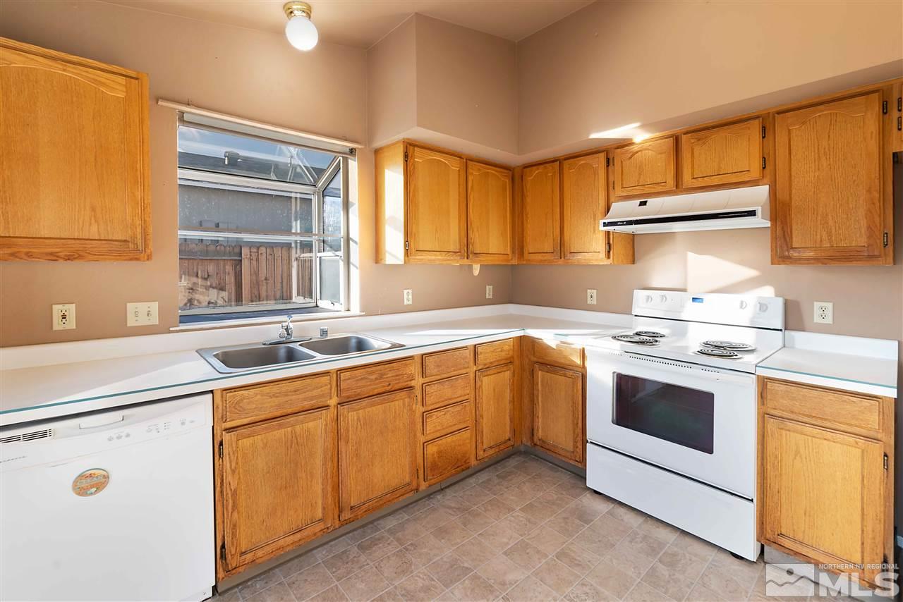 6314 Moon Ridge Terrace Reno, NV 89523 - Photo 10 of 24 a kitchen with a sink stove and cabinets