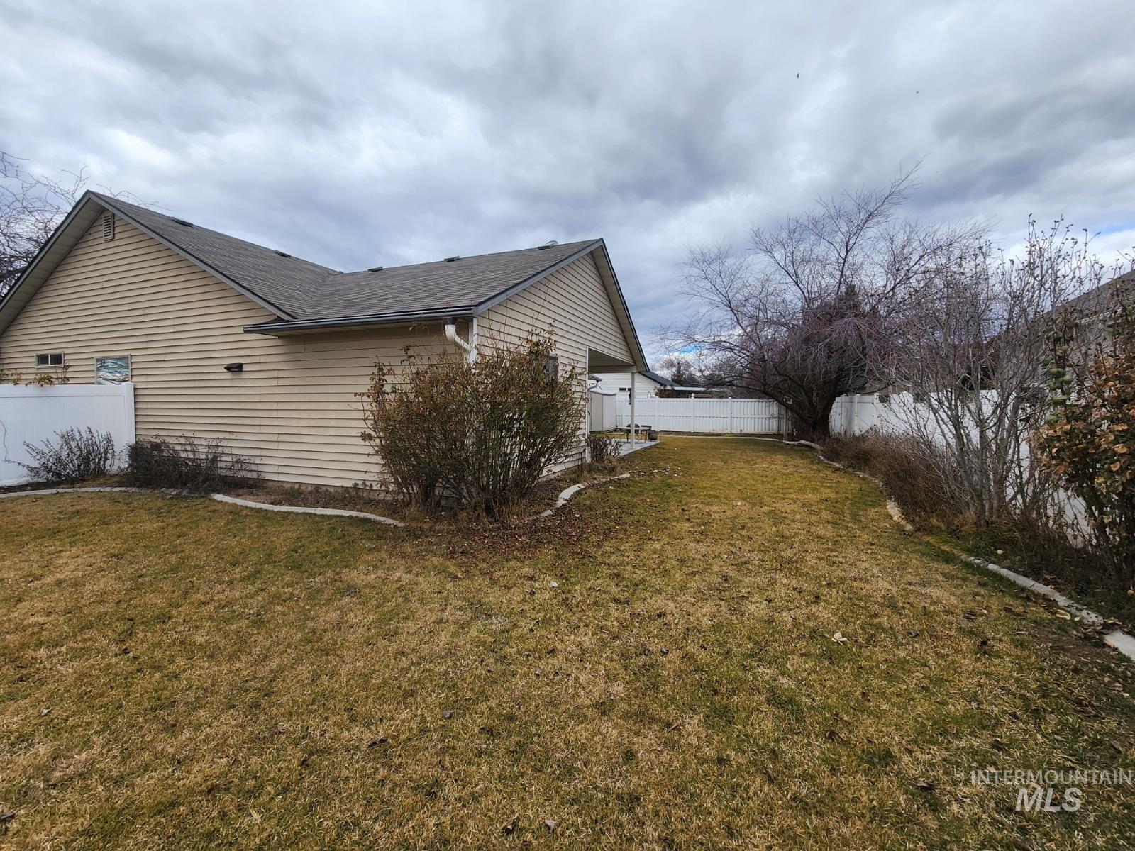 1000 North Rodeo Street Parma, ID 83660 - Photo 29 of 35 View of side of home featuring a fenced backyard
