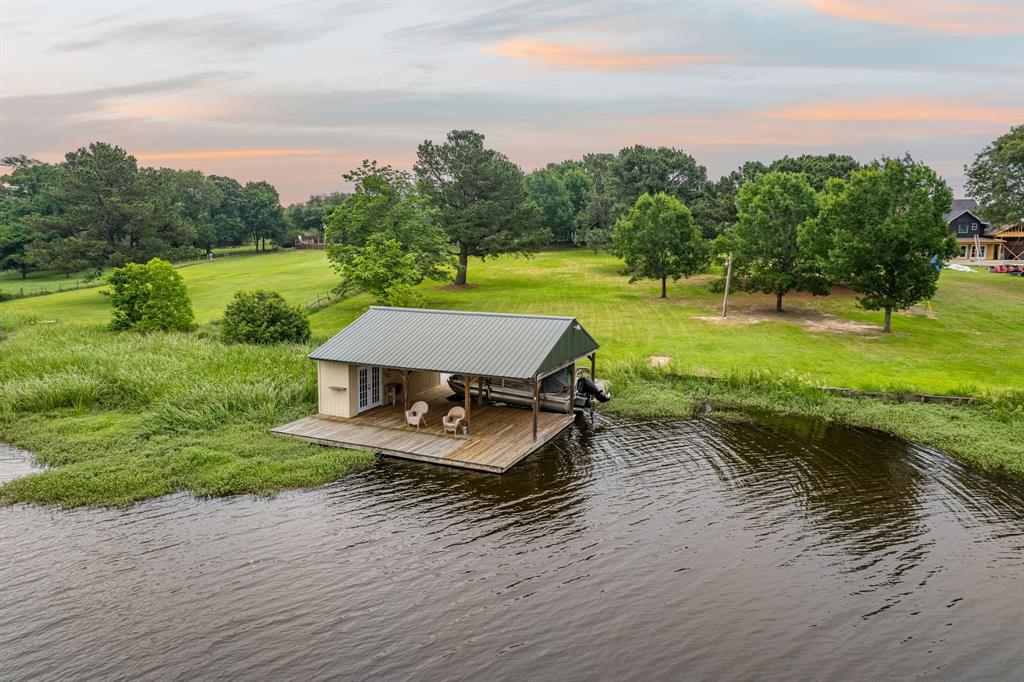 a wooden bench sitting in the middle of a lake
