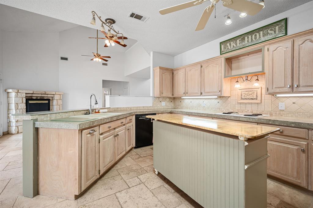 5327 Dusty Road Athens, TX 75752 - Photo 16 of 35 a kitchen with stainless steel appliances granite countertop a sink and cabinets