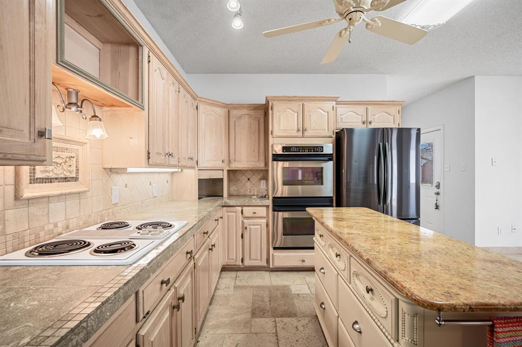 5327 Dusty Road Athens, TX 75752 - Photo 17 of 35 a kitchen with a sink stove and refrigerator