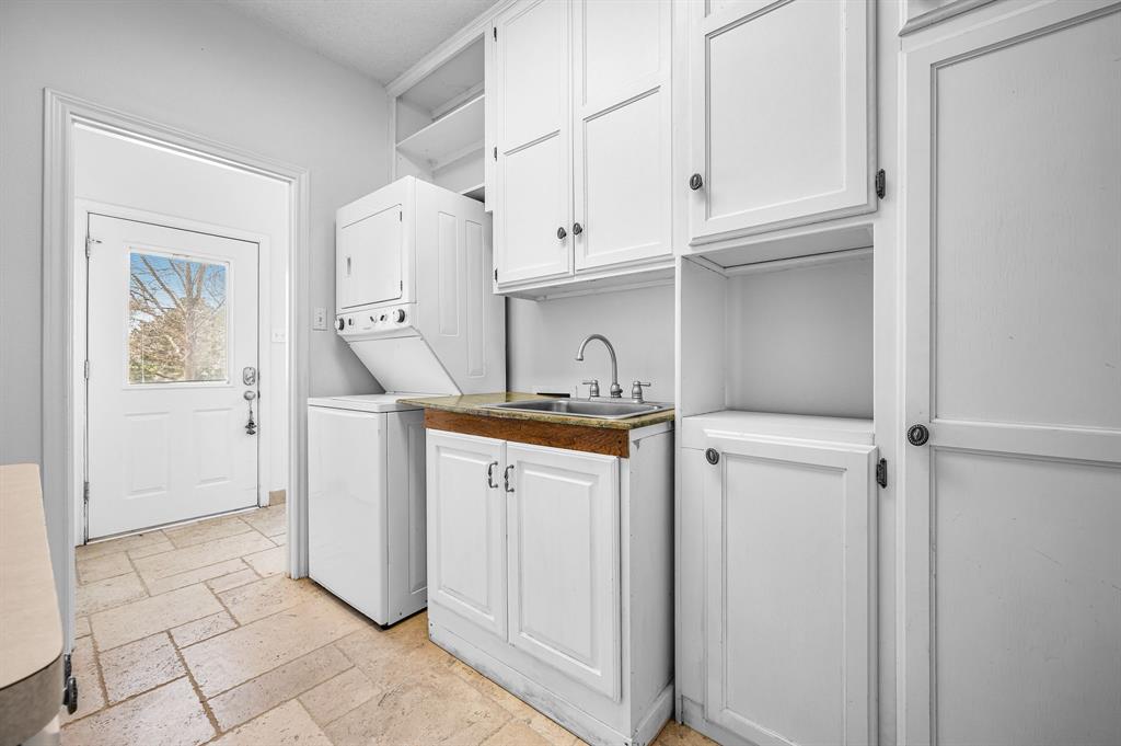 5327 Dusty Road Athens, TX 75752 - Photo 25 of 35 a utility room with cabinets washer and dryer