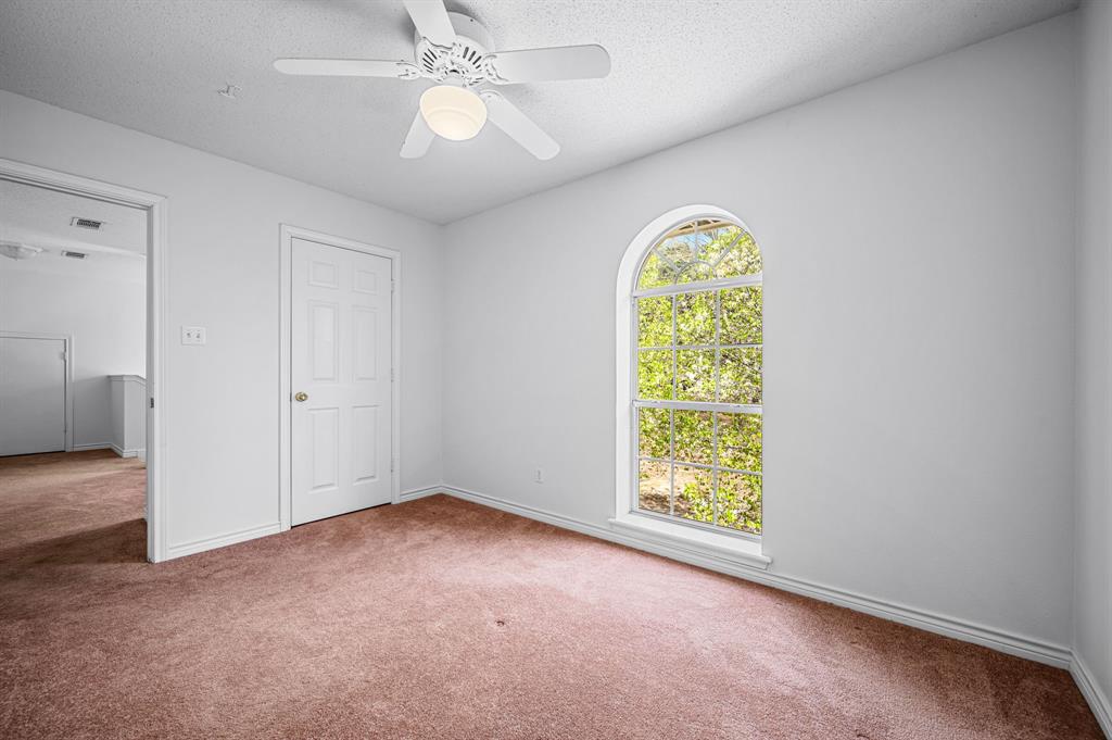 5327 Dusty Road Athens, TX 75752 - Photo 30 of 35 an empty room with windows and chandelier fan