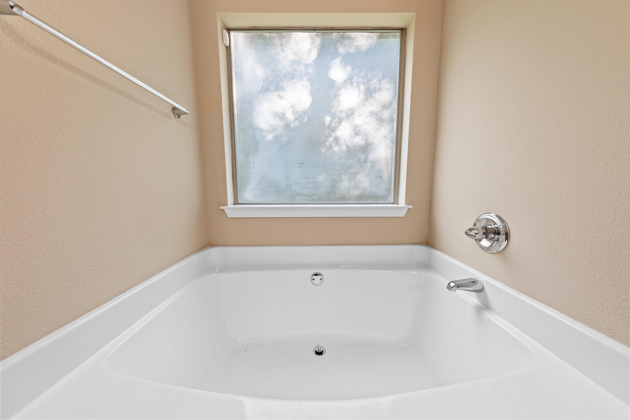 613 Red Fern Road Crestview, FL 32536 - Photo 17 of 39 a white bath tub sitting in a bathroom