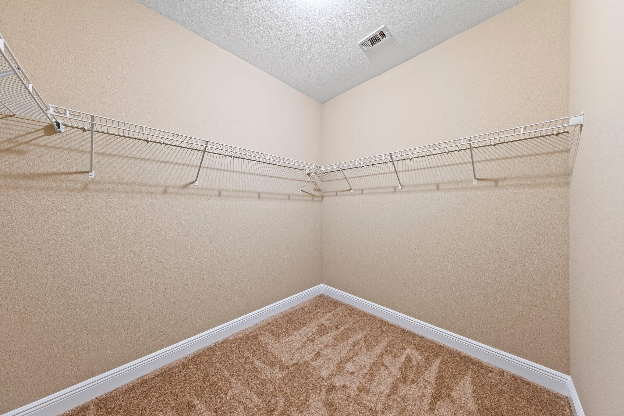 613 Red Fern Road Crestview, FL 32536 - Photo 18 of 39 a view of a room with racks on the wall