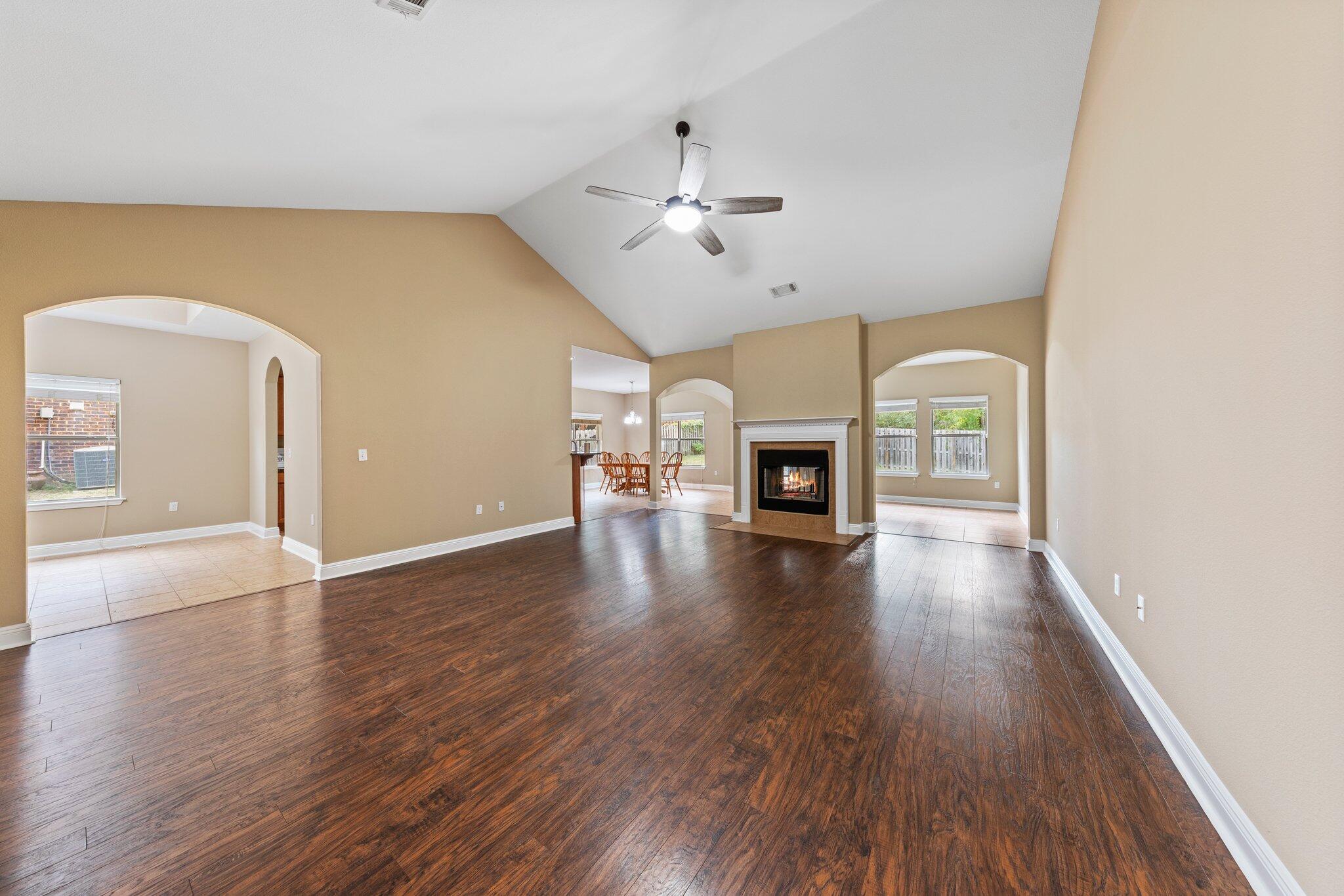 613 Red Fern Road Crestview, FL 32536 - Photo 19 of 39 a view of livingroom with hardwood floor and a ceiling fan