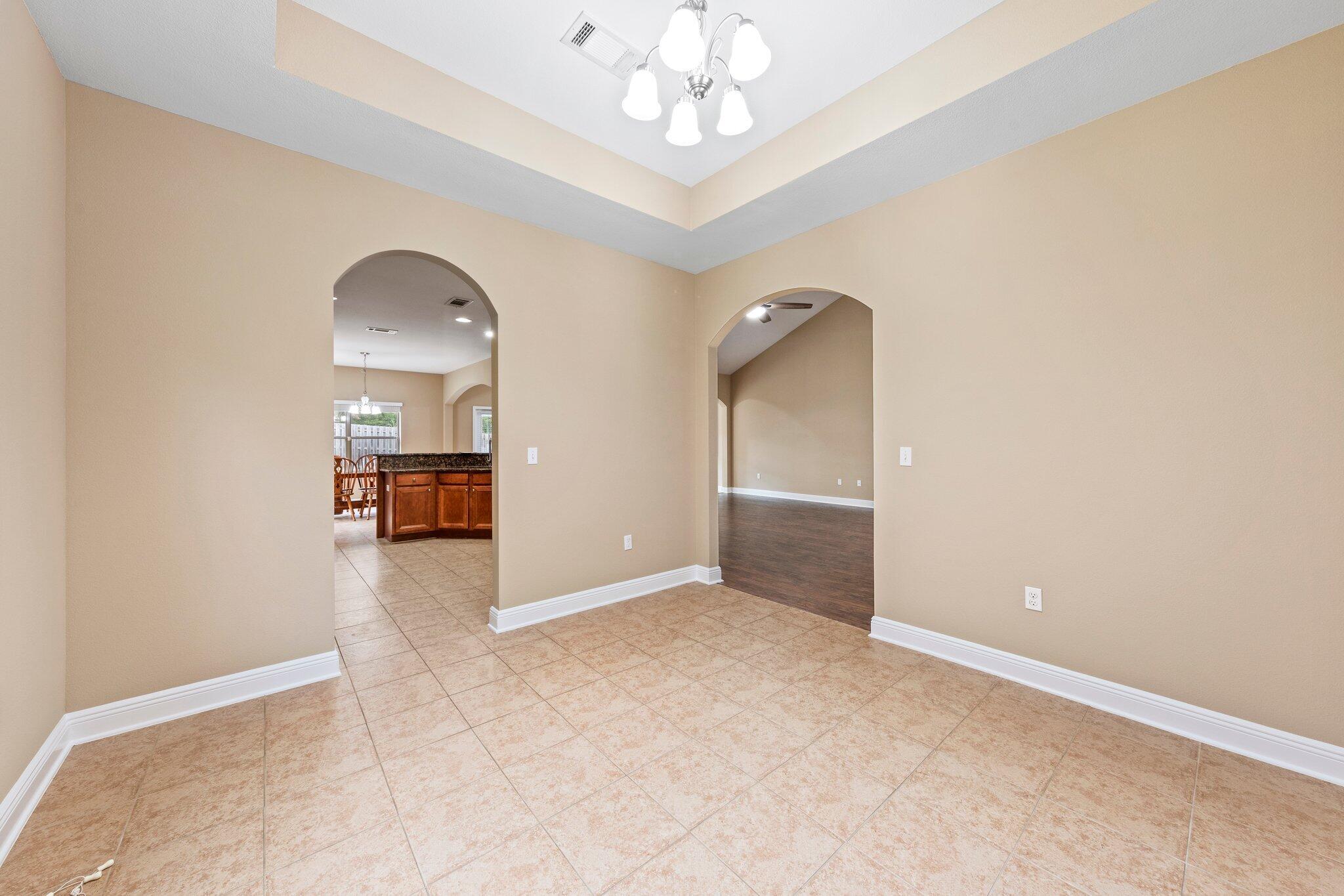 613 Red Fern Road Crestview, FL 32536 - Photo 23 of 39 wooden floor in an empty room with a window