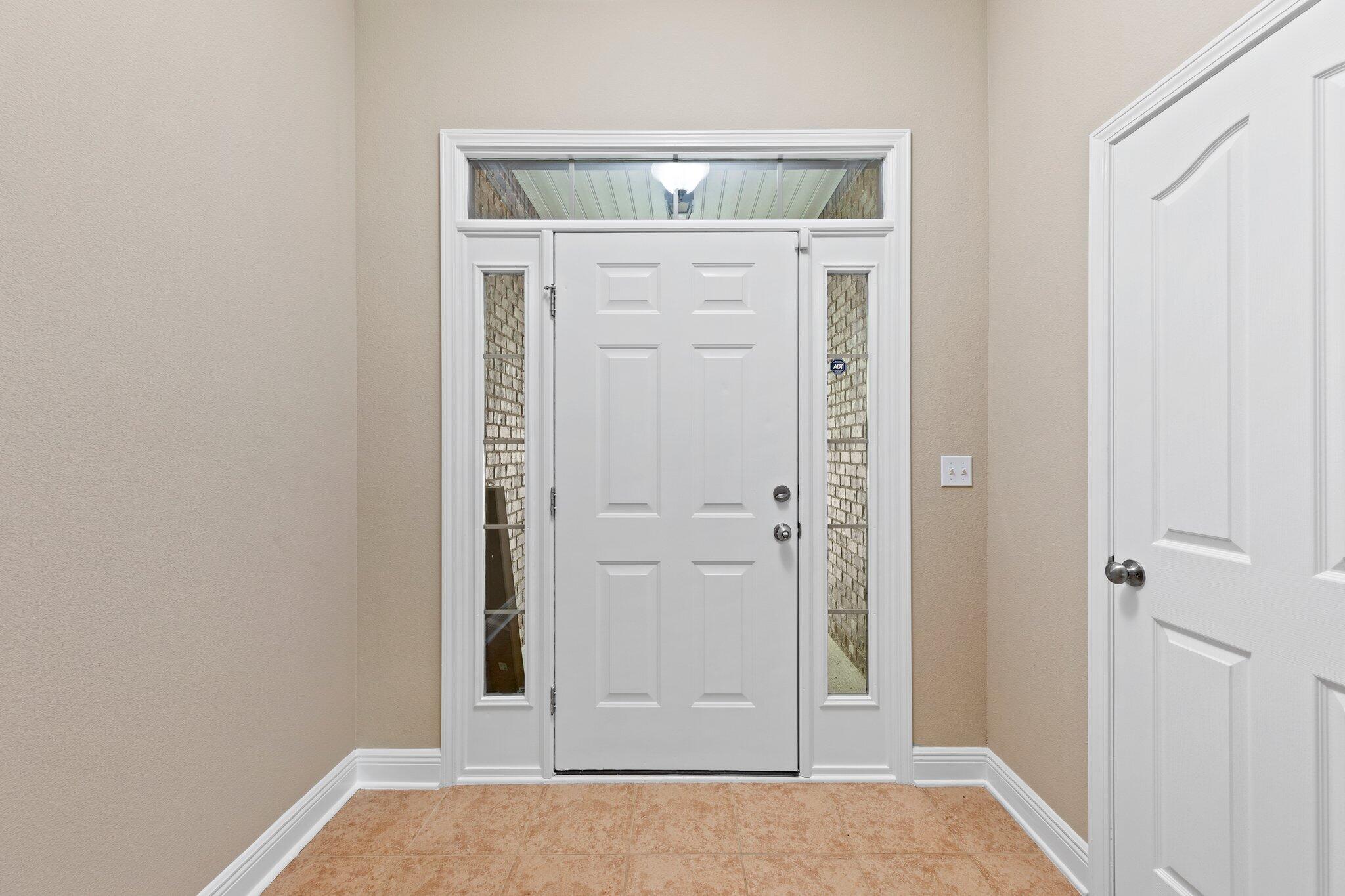 613 Red Fern Road Crestview, FL 32536 - Photo 3 of 39 an entryway view with wooden floor
