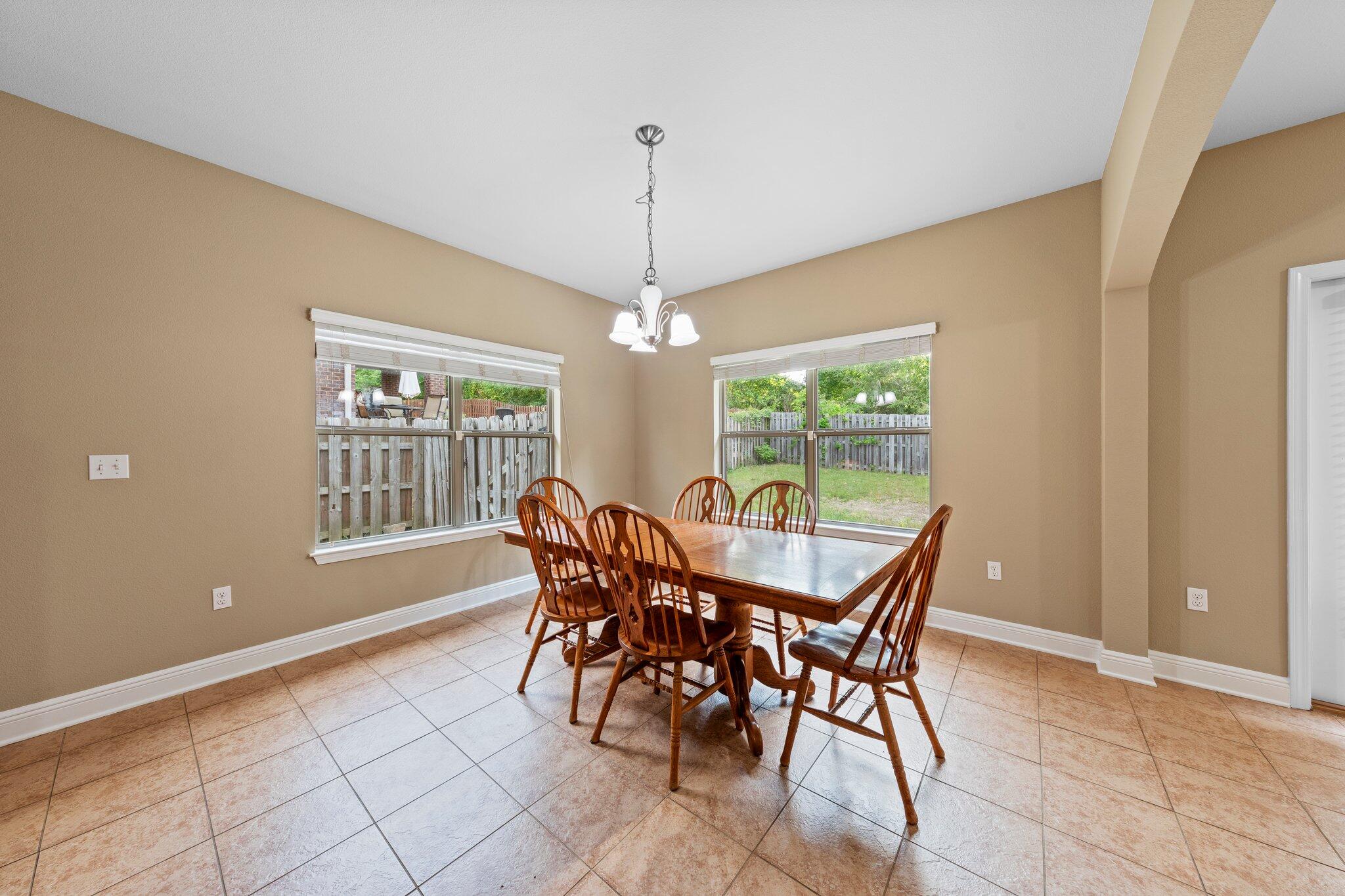 613 Red Fern Road Crestview, FL 32536 - Photo 31 of 39 a dining room with furniture and window