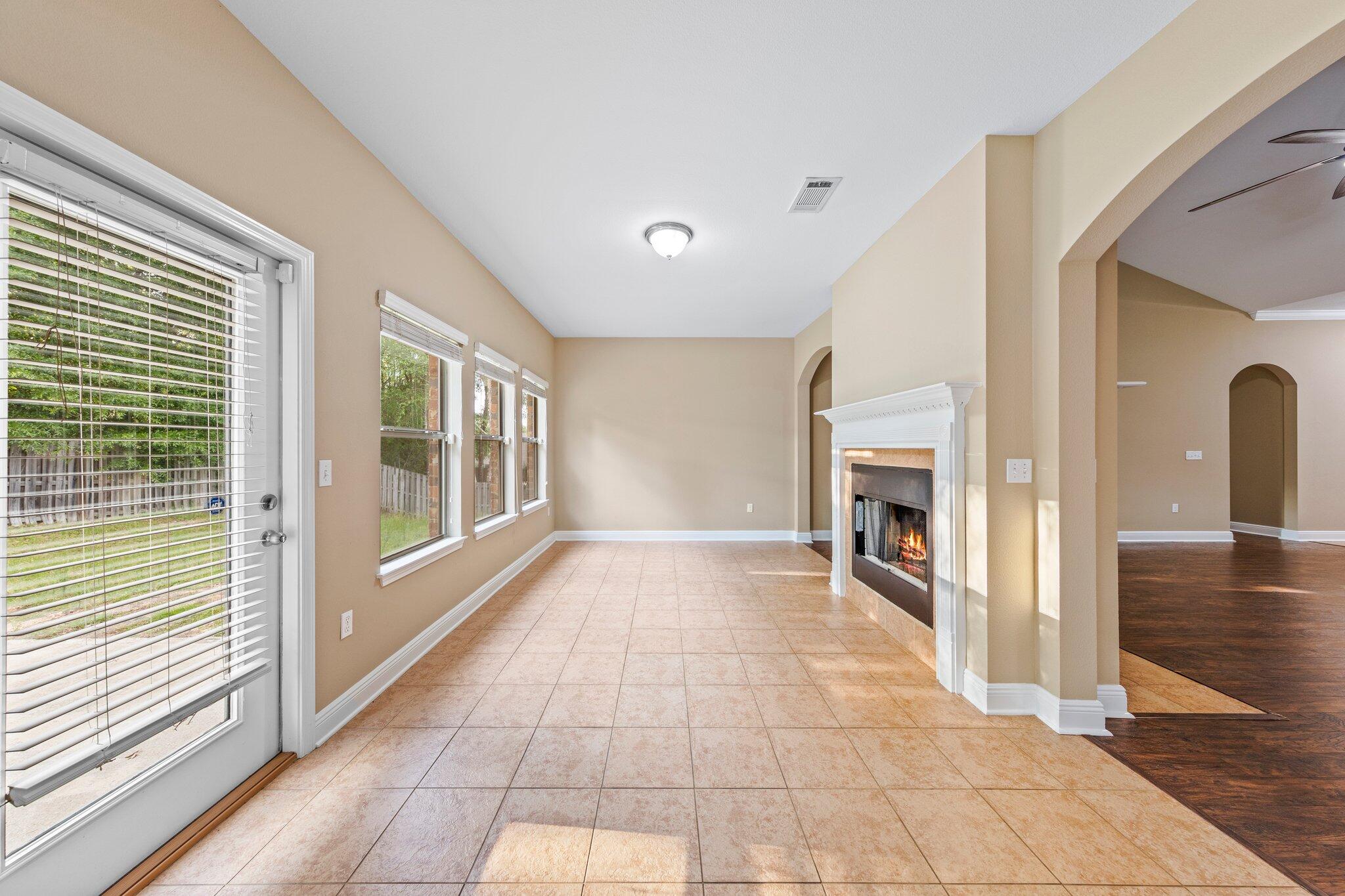 613 Red Fern Road Crestview, FL 32536 - Photo 33 of 39 a view of an entryway with wooden floor and a livingroom