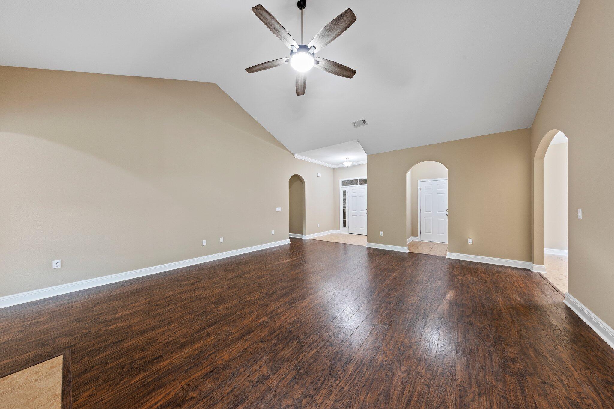 613 Red Fern Road Crestview, FL 32536 - Photo 36 of 39 a view of an empty room with window and wooden floor