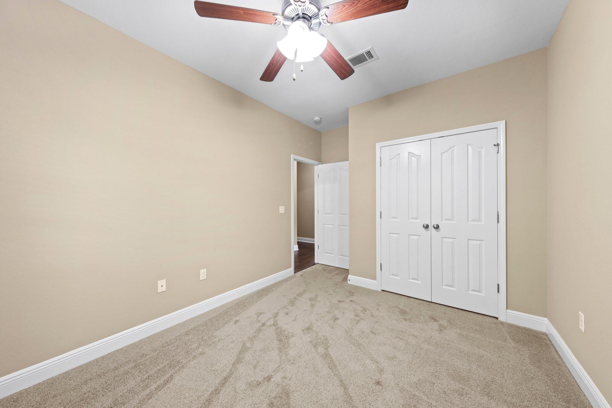 613 Red Fern Road Crestview, FL 32536 - Photo 7 of 39 a view of an empty room and chandelier fan