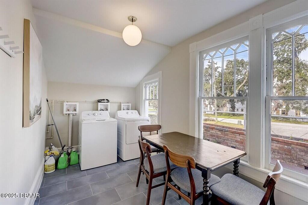 404 South Ridgewood Avenue Daytona Beach, FL 32114 - Photo 15 of 53 a view of a dining room with furniture window and outside view