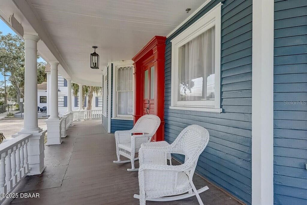 404 South Ridgewood Avenue Daytona Beach, FL 32114 - Photo 17 of 53 a balcony with table and chairs