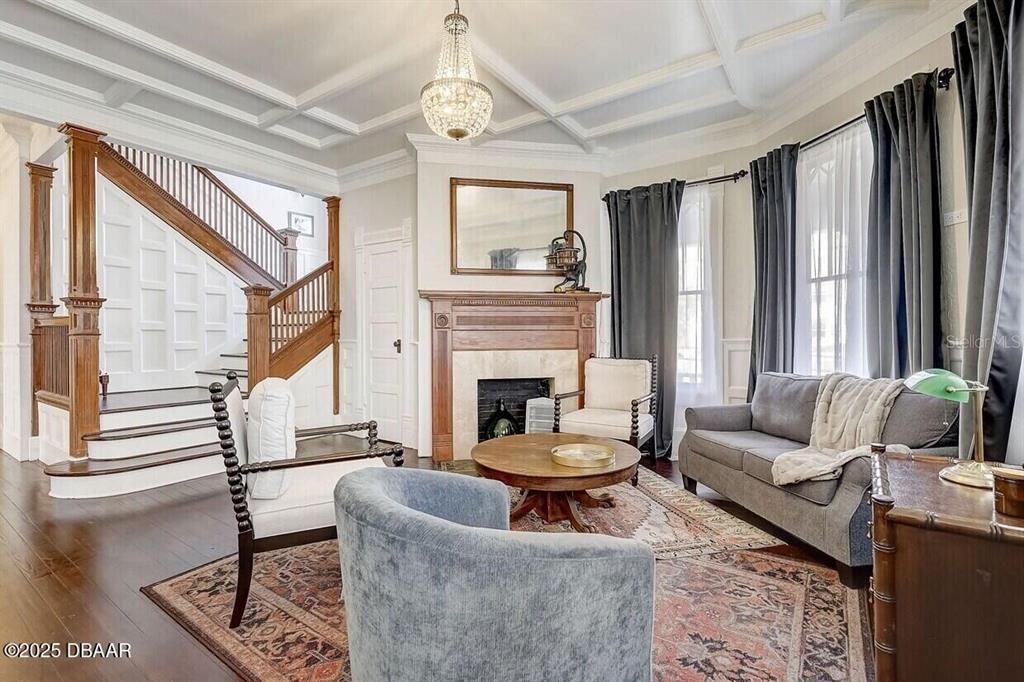 404 South Ridgewood Avenue Daytona Beach, FL 32114 - Photo 18 of 53 a living room with furniture a fireplace and a large window