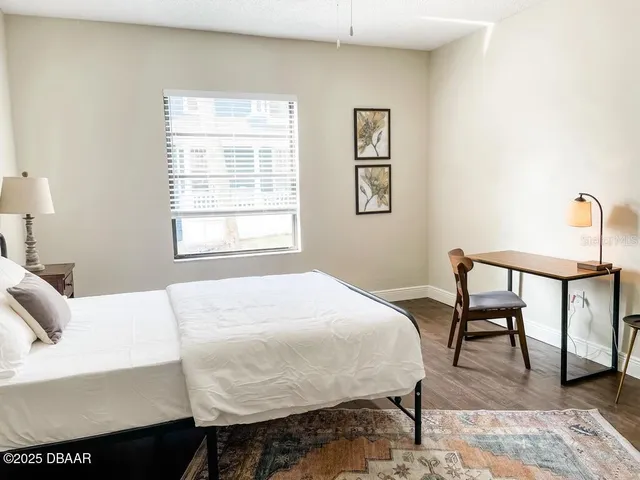 a view of bathroom with a sink and mirror