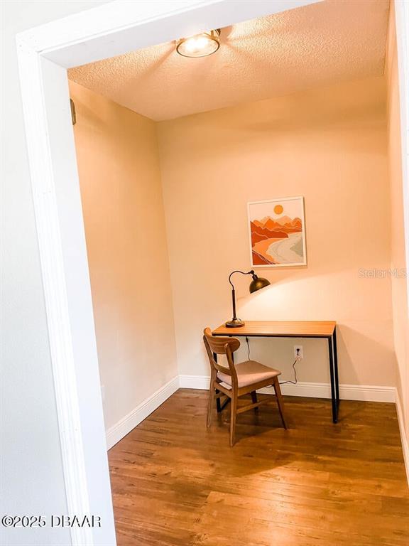 404 South Ridgewood Avenue Daytona Beach, FL 32114 - Photo 38 of 53 a view of a room with wooden floor and furniture