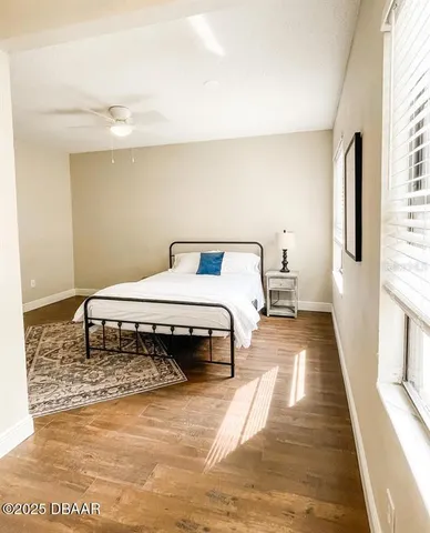 a bedroom with a bed and a table in it