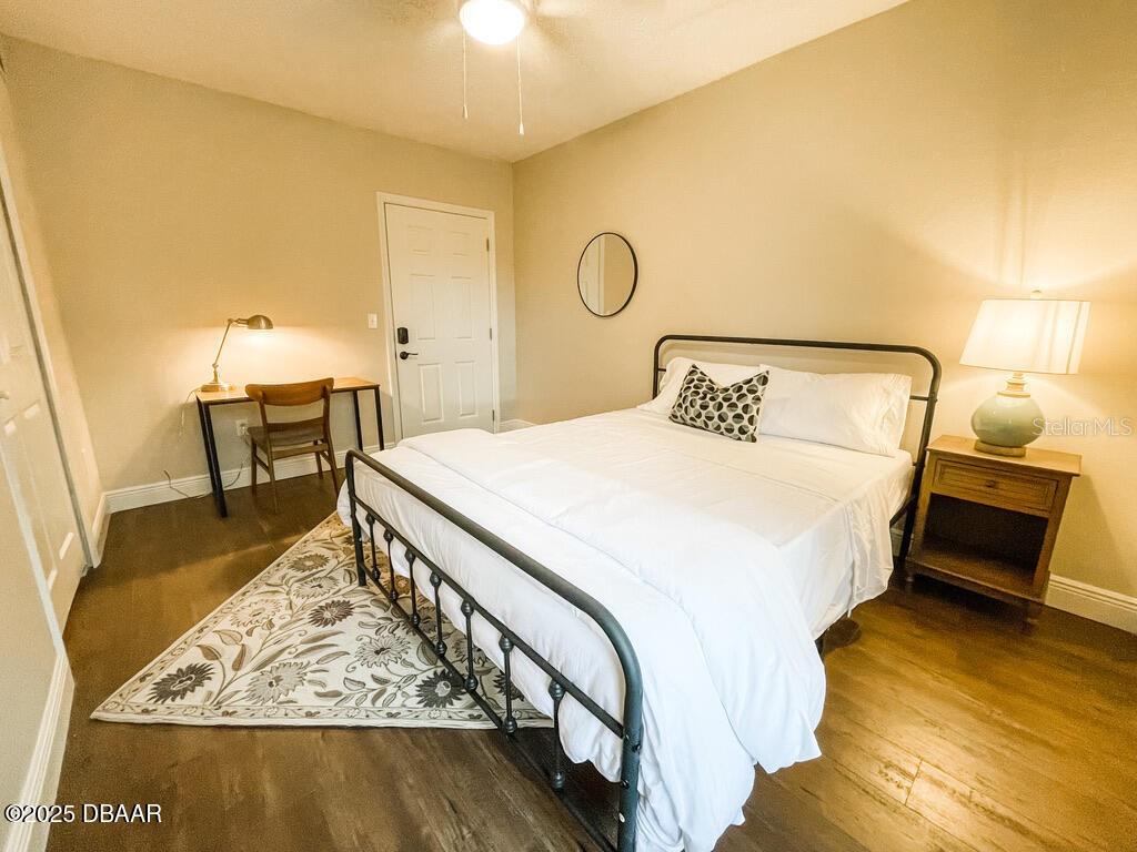 404 South Ridgewood Avenue Daytona Beach, FL 32114 - Photo 44 of 53 a bedroom with a bed and a table in it