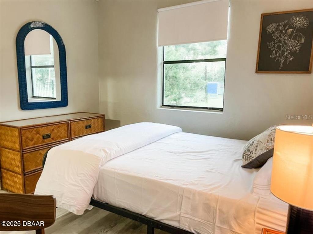 404 South Ridgewood Avenue Daytona Beach, FL 32114 - Photo 50 of 53 a bedroom with a bed and window