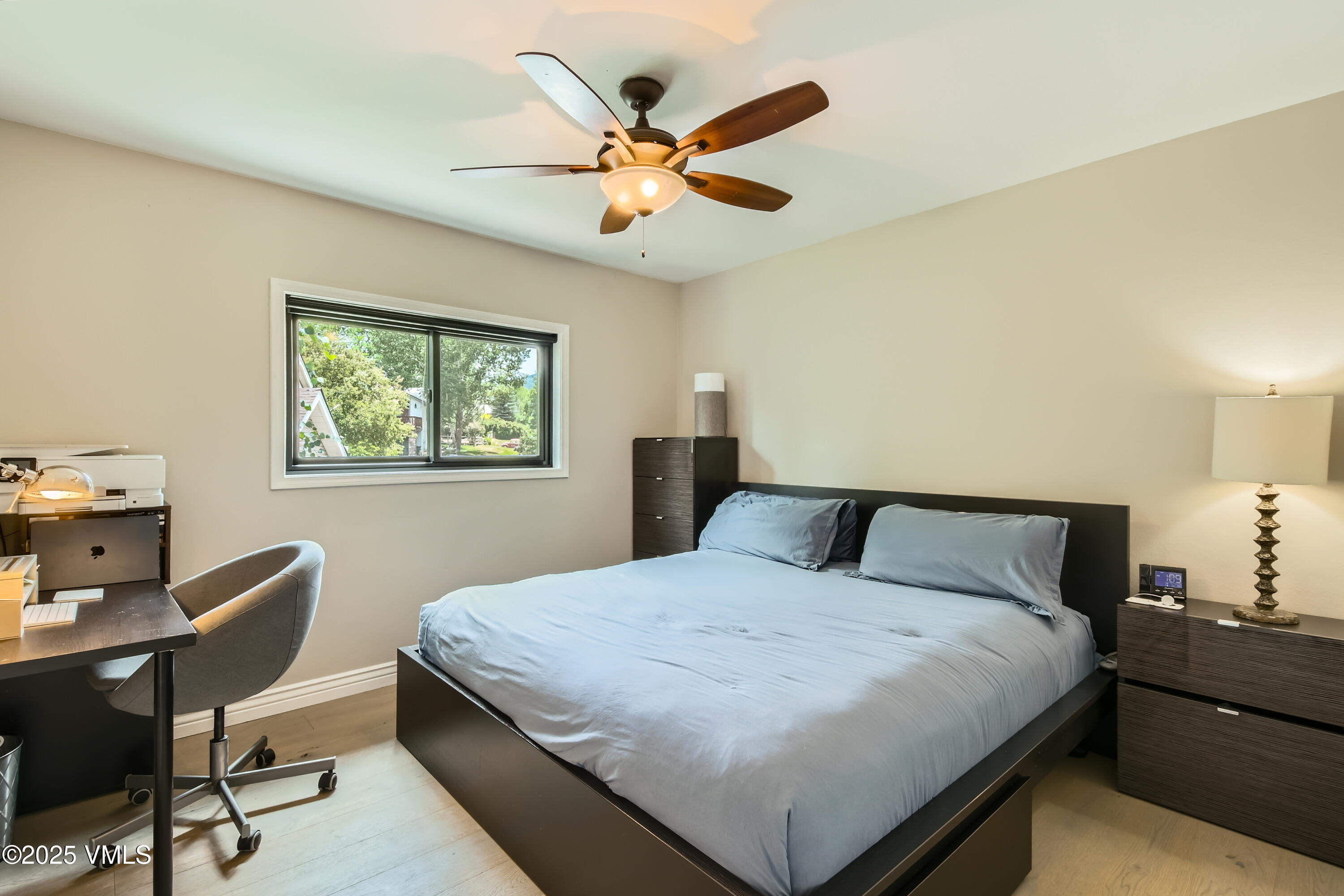 11 Spruce Circle Edwards, CO 81632 - Photo 12 of 27 a bedroom with a large bed and a desk