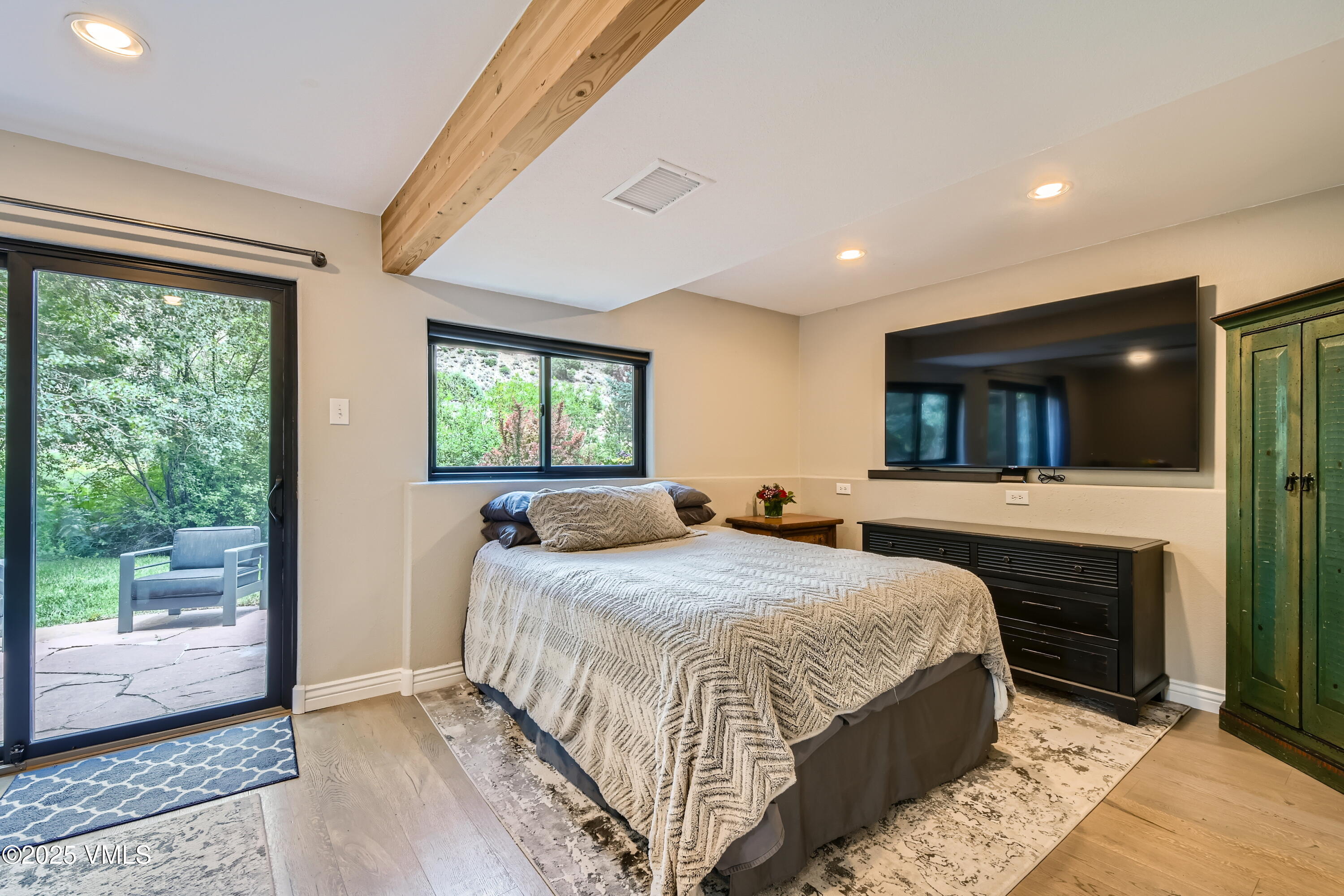 11 Spruce Circle Edwards, CO 81632 - Photo 18 of 27 a spacious bedroom with a large bed and a window