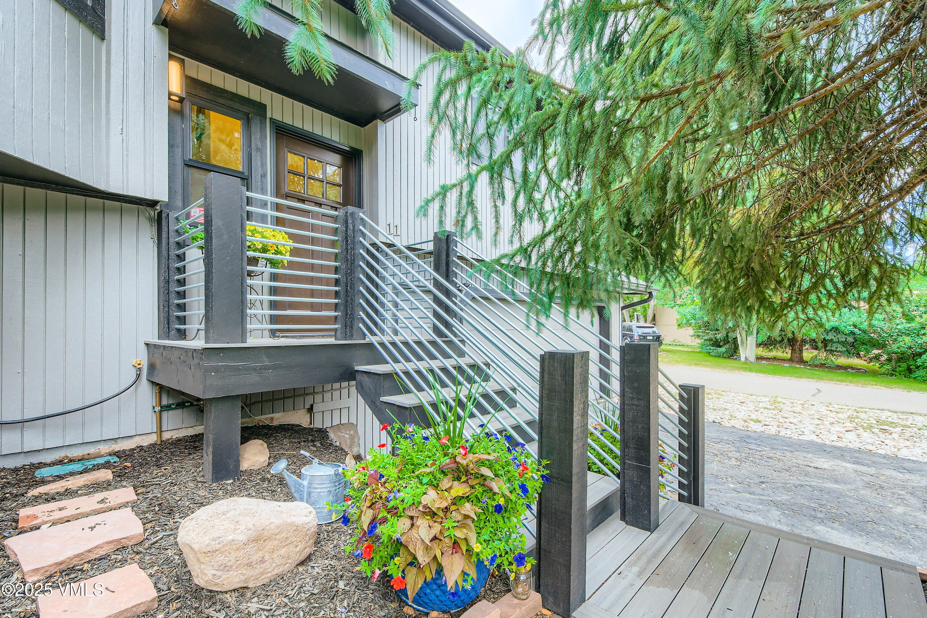 11 Spruce Circle Edwards, CO 81632 - Photo 20 of 27 a backyard of a house with wooden floor yard and outdoor seating