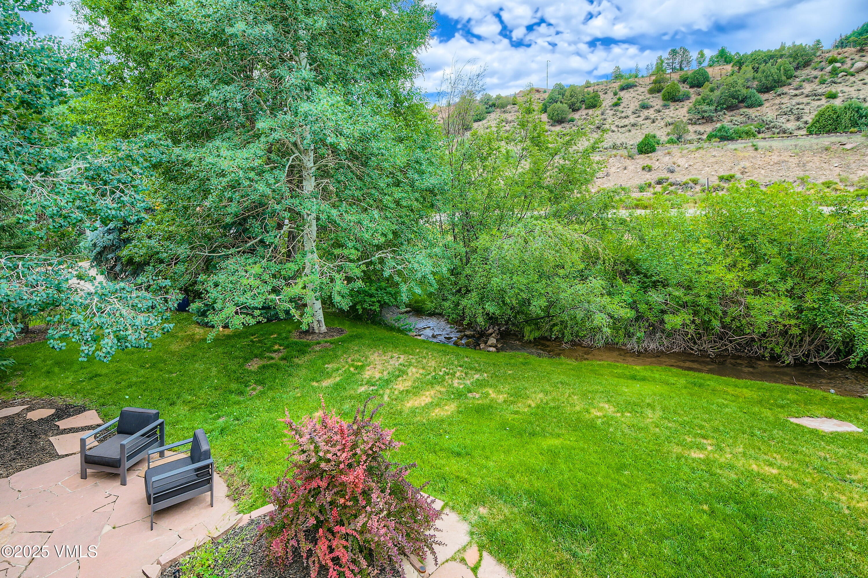 11 Spruce Circle Edwards, CO 81632 - Photo 8 of 27 a yard with lots of green space